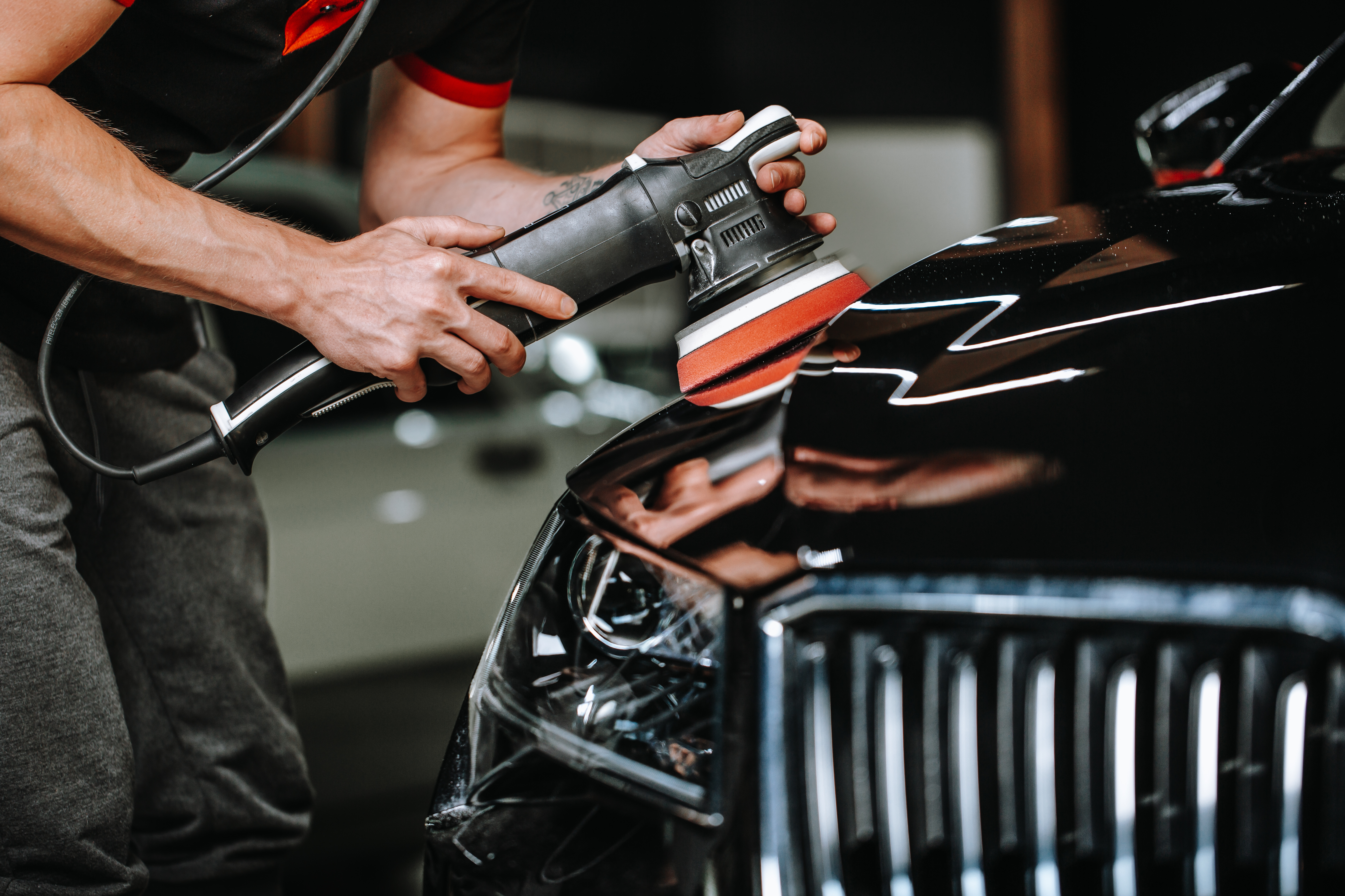 Professional detailing of vehicle headlight with orbital buffer tool